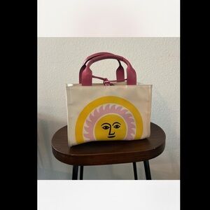 Vintage Kate Spade Sun Canvas Pink Leather Bag, measuring 10.5 x 7 inches.